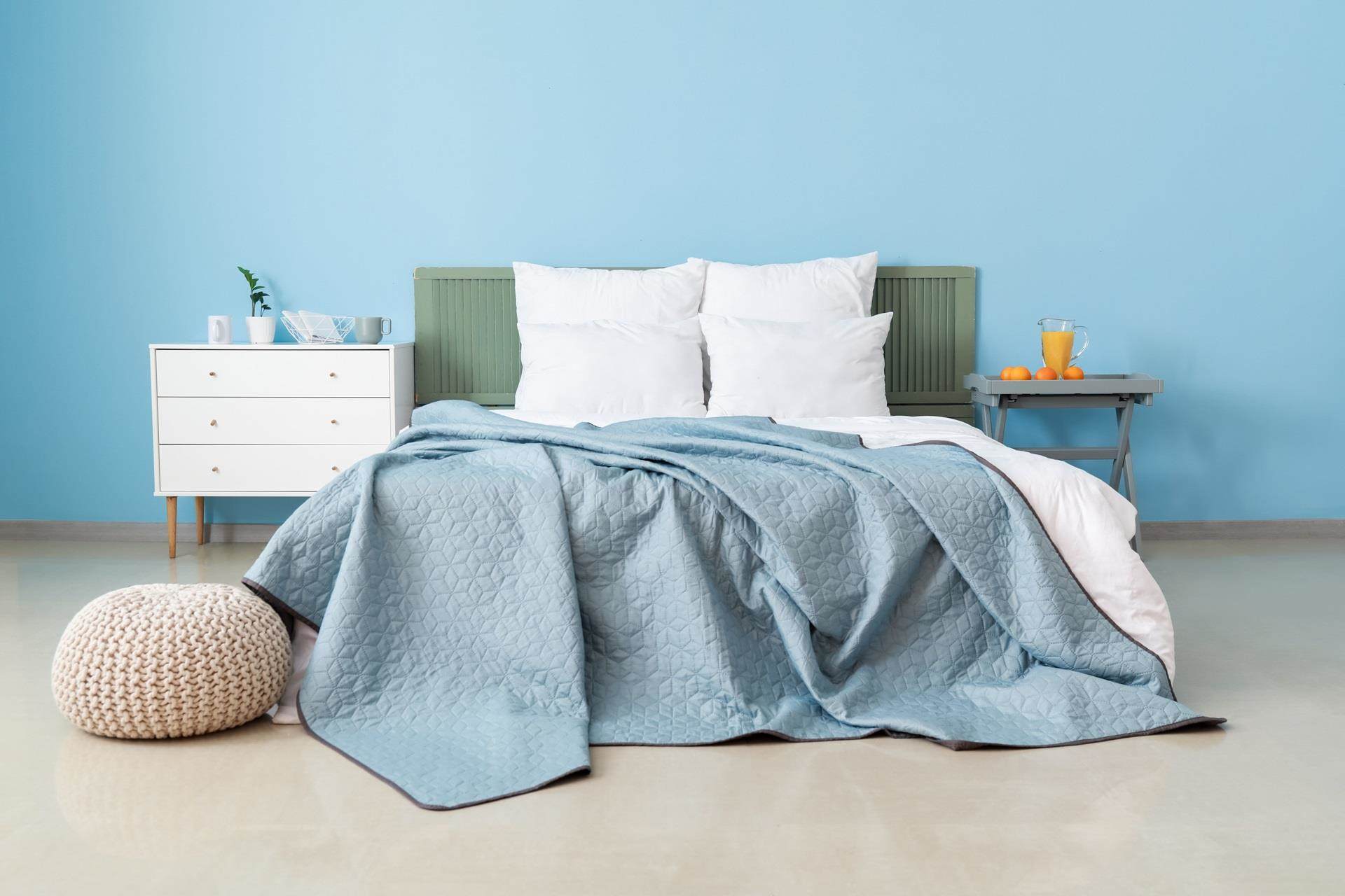 Bed with blue throw